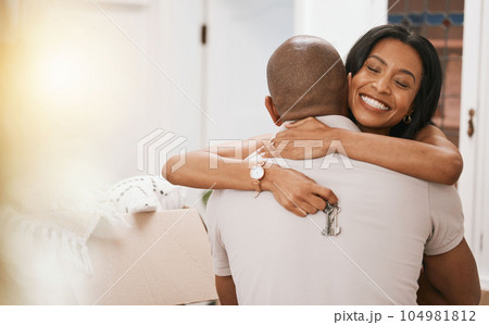Happy couple, hug and keys for real estate purchase, property or homeowner with mortgage loan or finance. Woman and man realtor hugging with key to house, moving or sale for new home and investment 104981812