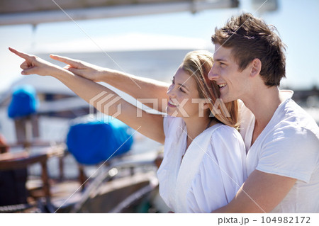 Happy, travel and couple point on yacht with smile on summer holiday, vacation and adventure on ocean. Love, travelling and man and woman pointing on luxury cruise for journey, romantic trip and fun Happy, travel and couple point on yacht with smile on summer holiday, vacation and adventure on ocean. Love, travelling and man and woman pointing on luxury cruise for journey, romantic trip and fun 104982172