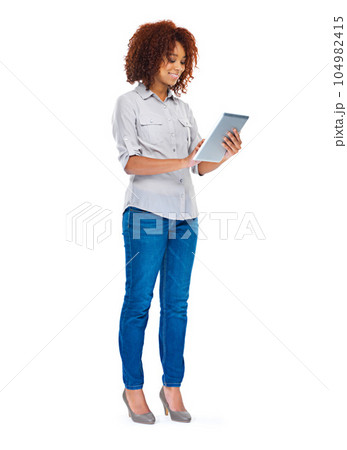 Isolated woman, texting and tablet in studio for social media app, contact and communication by white background. Young african lady, model and touchscreen for web design job, smile and connectivity 104982415