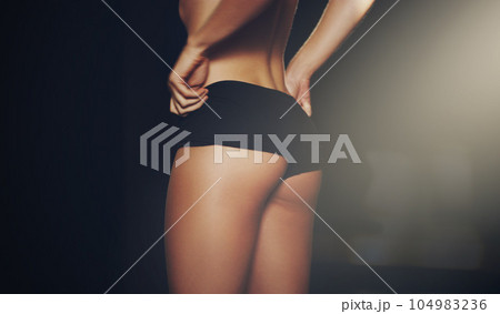 Rear view of woman, butt and black underwear on studio background for weightloss mockup, diet and slim size. Closeup female model, ass and sexy lingerie of aesthetic liposuction, beauty and fit body 104983236