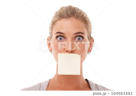 Sticky note, wow and shocked face of woman with covered mouth isolated against a studio white background. Portrait of surprised, alert and censored caucasian corporate female or entrepreneur Sticky note, wow and shocked face of woman with covered mouth isolated against a studio white background. Portrait of surprised, alert and censored caucasian corporate female or entrepreneur 104983892