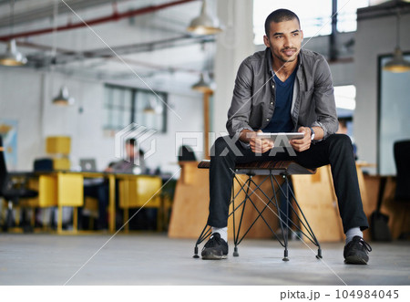 Creative, startup or man with a tablet, thinking or planning with ideas, opportunity or solution. Male person, business owner or entrepreneur with technology, problem solving with a decision or smile 104984045