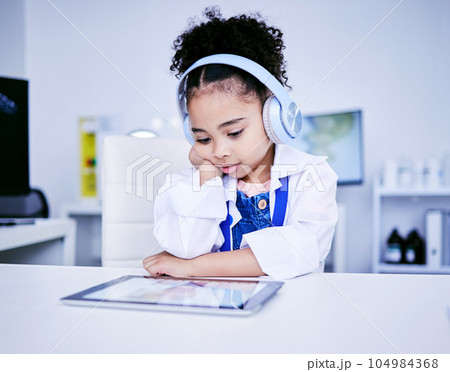 Black girl, education and science on tablet or headphones for remote work on ebook. Read, tech and digital studying with female student for knowledge, lessons or internet for development or learning. 104984368