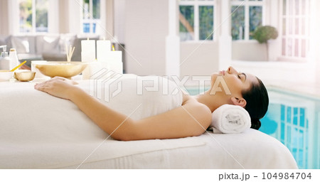 Woman, relax and sleeping on bed at spa for zen, physical therapy or healthy massage at resort. Calm female person relaxing in peaceful sleep for luxury body treatment in self love or care at a salon 104984704