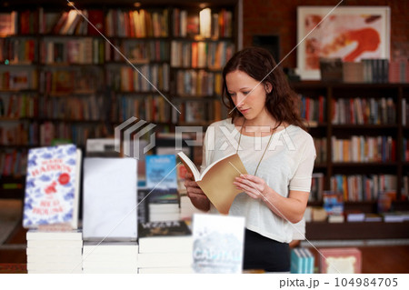 Woman, book and reading in a store, library or bookstore customer and choosing a novel to buy, read or study. Girl, bookshelf and studying books for college, university or research information Woman, book and reading in a store, library or bookstore customer and choosing a novel to buy, read or study. Girl, bookshelf and studying books for college, university or research information 104984705