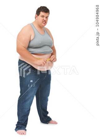 Obesity, tape measure on abdomen and portrait of angry man checking size, body health and isolated on white background. Frustrated male, measuring stomach and weight loss progress on studio backdrop. Obesity, tape measure on abdomen and portrait of angry man checking size, body health and isolated on white background. Frustrated male, measuring stomach and weight loss progress on studio backdrop. 104984968