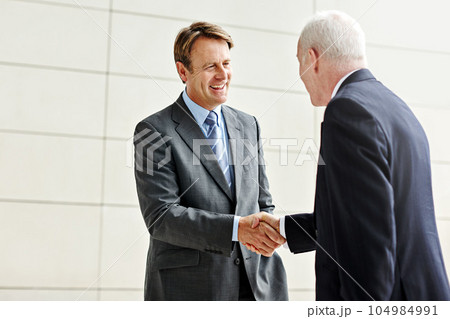 Business man, handshake and partnership meeting, welcome and introduction or contract, agreement and success. Professional man, CEO or corporate clients shaking hands for thank you, interview or deal Business man, handshake and partnership meeting, welcome and introduction or contract, agreement and success. Professional man, CEO or corporate clients shaking hands for thank you, interview or deal 104984991