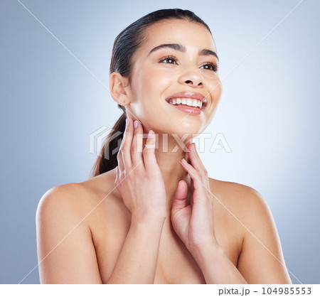 Smile, skincare and hands on face of woman in studio for wellness, glowing skin or cosmetic satisfaction on grey background. Beauty, soft and asian lady model happy with dermatology, luxury or result 104985553