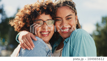 Friends, sisters and portrait of black women hugging outside with smile, happiness and solidarity in love and pride. Lesbian couple, woman and friend in happy embrace for support and trust together. Friends, sisters and portrait of black women hugging outside with smile, happiness and solidarity in love and pride. Lesbian couple, woman and friend in happy embrace for support and trust together. 104985612
