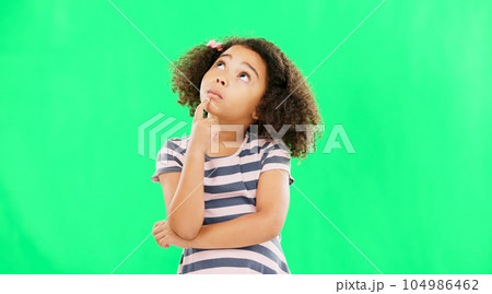 Thinking, idea and green screen with young girl in a studio contemplating and relax planning. Question, youth thought and kid with ideas and creative vision feeling curious with contemplation Thinking, idea and green screen with young girl in a studio contemplating and relax planning. Question, youth thought and kid with ideas and creative vision feeling curious with contemplation 104986462