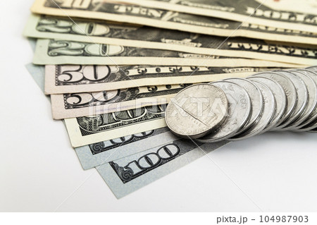 US american dollar money bills and coins cents spread on white background US american dollar money bills and coins cents spread on white background 104987903