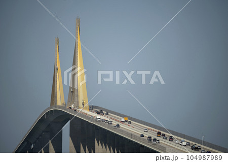 Sunshine Skyway Bridge over Tampa Bay in Florida with moving traffic. Concept of transportation infrastructure 104987989