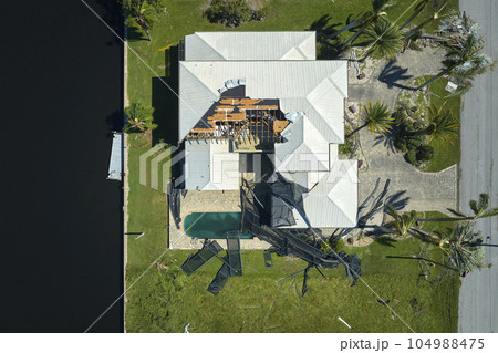 Hurricane Ian destroyed house in Florida residential area. Natural disaster and its consequences Hurricane Ian destroyed house in Florida residential area. Natural disaster and its consequences 104988475