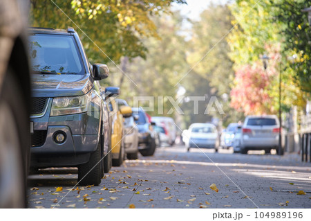Close up of a car parked illegally against traffic rules on pedestrian city street side 104989196