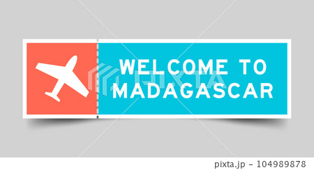 Orange and blue color ticket with plane icon and word welcome to madagascar on gray background 104989878