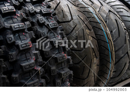 Tyre shop for sale in the store. Sale of car tires. 104992003