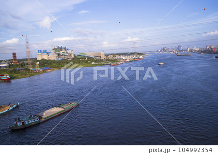 Aerial view of the river and industrial area with blue sky in Narayanganj-Bangladesh Aerial view of the river and industrial area with blue sky in Narayanganj-Bangladesh 104992354