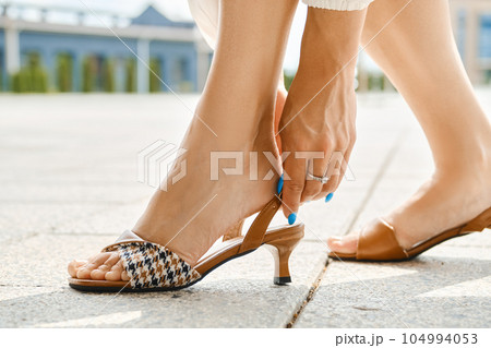 Closeup view of fastening strap on sandals Closeup view of fastening strap on sandals 104994053