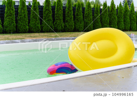 Raindrops fall on the surface of the pool. Raindrops fall on the surface of the pool. 104996165