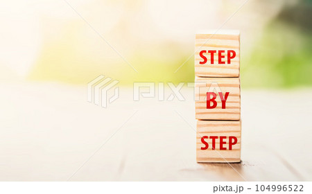 he word step by step on wooden cubes. Achievement or progress in business career. Business growth, career growth or goal concept. he word step by step on wooden cubes. Achievement or progress in business career. Business growth, career growth or goal concept. 104996522