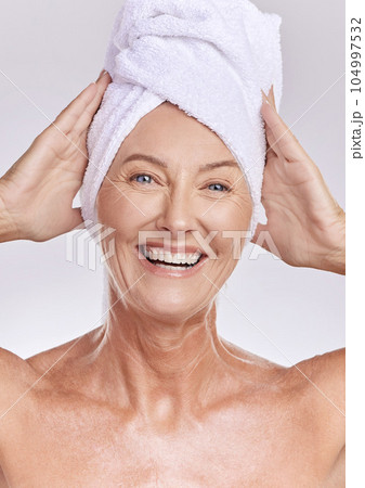 Portrait, senior or happy woman with beauty, towel or smile in studio isolated on white background. Dermatology, face or mature lady with natural facial skincare cosmetics or glowing shine in spa Portrait, senior or happy woman with beauty, towel or smile in studio isolated on white background. Dermatology, face or mature lady with natural facial skincare cosmetics or glowing shine in spa 104997532