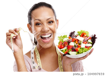 Diet, measuring tape and portrait of woman with salad for health, wellness and lose weight nutrition lifestyle. Smile of happy black woman with healthy food on isolated white background. 104997659