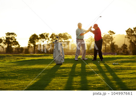Trainer, golf course or man with help, teaching or fitness with training, lesson or skills. Male person, player or coach with golfer, advice or sports with professional, physical activity or exercise Trainer, golf course or man with help, teaching or fitness with training, lesson or skills. Male person, player or coach with golfer, advice or sports with professional, physical activity or exercise 104997661