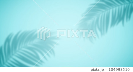 Shadow from palm leaves on a turquoise background. Shadow from palm leaves on a turquoise background. 104998510