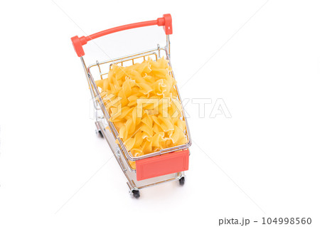 Uncooked Fusilli Pasta in Small Shopping Cart Isolated on White Uncooked Fusilli Pasta in Small Shopping Cart Isolated on White 104998560