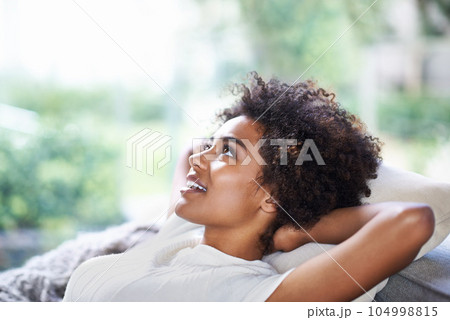Relax, thinking and happy woman on sofa in lounge, afternoon nap and rest in calm apartment on weekend. Daydream ideas, peace and girl on couch relaxing, self care and stress free chill time in home. Relax, thinking and happy woman on sofa in lounge, afternoon nap and rest in calm apartment on weekend. Daydream ideas, peace and girl on couch relaxing, self care and stress free chill time in home. 104998815