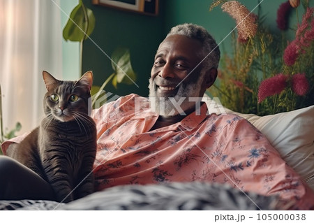 Mature African American man with his cat at home. Mature African American man with his cat at home. 105000038