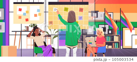 mix race girls in colorful clothes working in office lgbt rainbow flag transgender love generation Z concept mix race girls in colorful clothes working in office lgbt rainbow flag transgender love generation Z concept 105003534