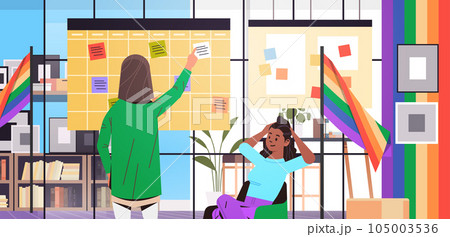 mix race girls in colorful clothes working in office lgbt rainbow flag transgender love generation Z concept mix race girls in colorful clothes working in office lgbt rainbow flag transgender love generation Z concept 105003536