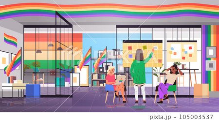 mix race girls in colorful clothes working in office lgbt rainbow flag transgender love generation Z concept mix race girls in colorful clothes working in office lgbt rainbow flag transgender love generation Z concept 105003537