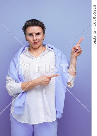 a bright young woman in an informal bow charismatically points her finger at space a bright young woman in an informal bow charismatically points her finger at space 105005518