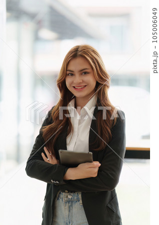 Portrait of young happy woman and confident business at office Portrait of young happy woman and confident business at office 105006049
