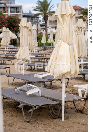 Beach in Antalya, Turkiye. Umbrellas and sun loungers in the assembled state on the beach. 105006601