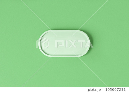 Podium for cosmetic product presentation. Abstract minimal geometrical form on green background. Oval stone form. Scene, Showcase, display. Minimal design. Soft shadow. Flat lay, Top View. Copy space Podium for cosmetic product presentation. Abstract minimal geometrical form on green background. Oval stone form. Scene, Showcase, display. Minimal design. Soft shadow. Flat lay, Top View. Copy space 105007251