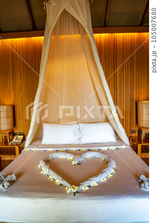 Bedroom inside a cabin on the beach in Haad Tien Beach in shark bay, koh Tao, Thailand Bedroom inside a cabin on the beach in Haad Tien Beach in shark bay, koh Tao, Thailand 105007680
