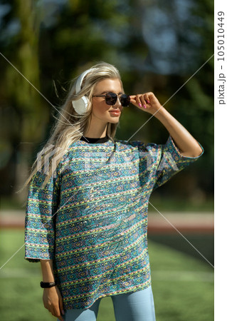 blonde athletic girl stands on the football field blonde athletic girl stands on the football field 105010449