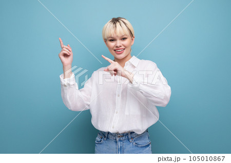 young beautiful blond office worker woman with a bob hairstyle and dressed in a white shirt shows young beautiful blond office worker woman with a bob hairstyle and dressed in a white shirt shows 105010867