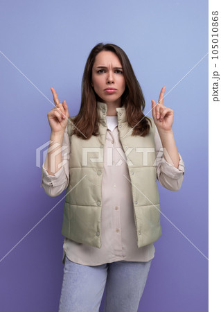 emotional black-haired young lady in casual clothes reports an idea that has arisen in her head on emotional black-haired young lady in casual clothes reports an idea that has arisen in her head on 105010868