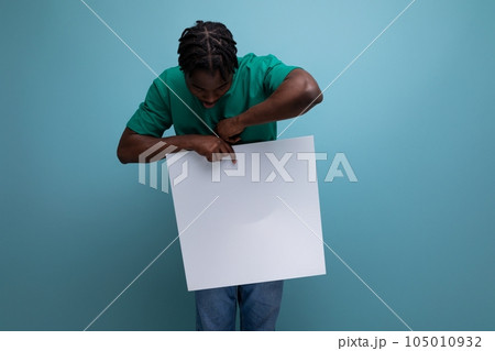 american male promoter holding paper poster 105010932