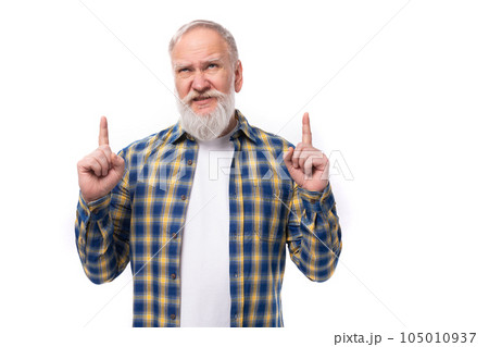 mature gray-haired retired man with a mustache and beard shows with his hands for the presence of a 105010937