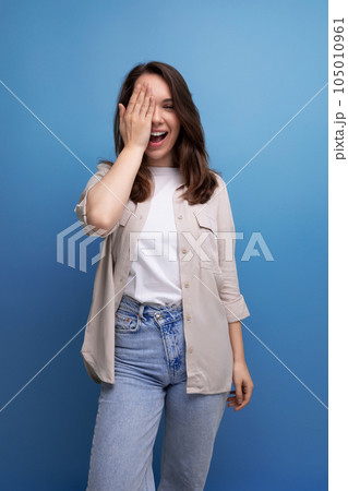 brunet young brunette lady dressed casual cute smiling on blue background 105010961