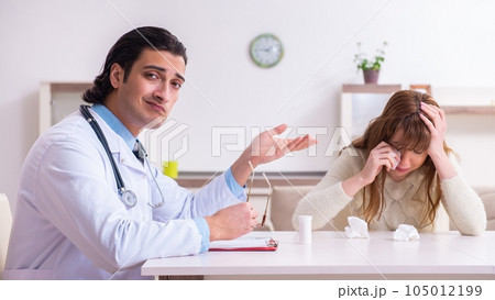 Young female patient discussing with male psychologist personal 105012199