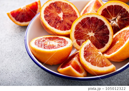 Blood oranges cut into half 105012322