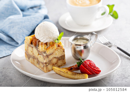 Warm apple bread pudding with ice cream 105012584
