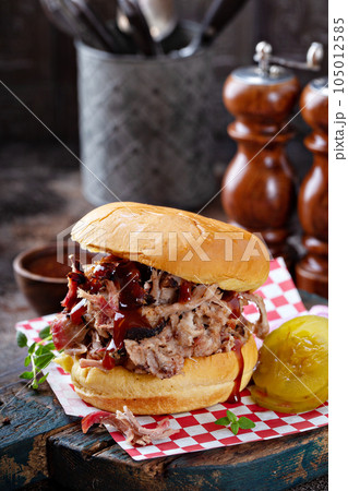 Pulled pork sandwich with pickles Pulled pork sandwich with pickles 105012585