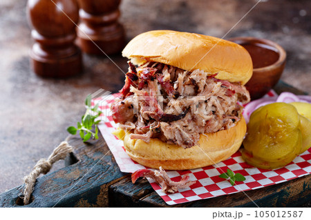 Pulled pork sandwich with pickles Pulled pork sandwich with pickles 105012587